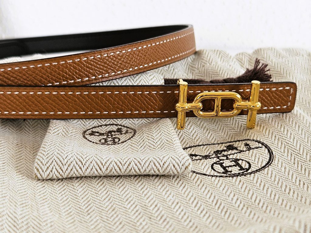 Hermes Wendegürtel schwarz - gold mit Staubbeutel